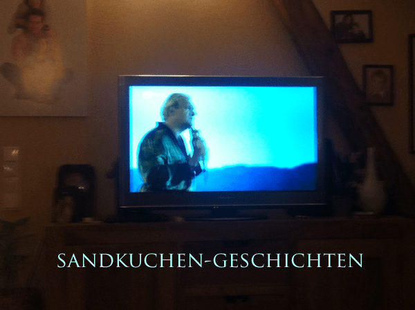 charly-huebner-mit-gelben-h